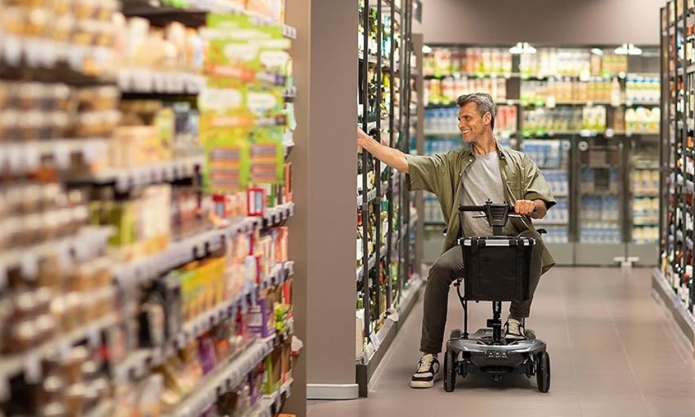 Man driving a scooter to shop