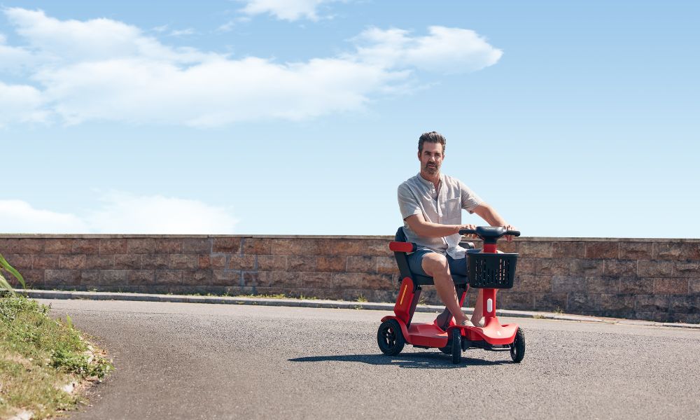 Man driving an electric scooter on the road